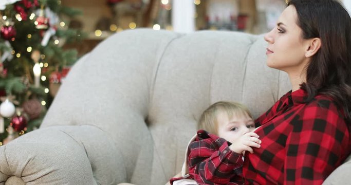 Mom breastfeeds her son