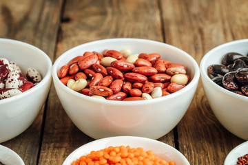 Super food. Seeds and beans assortment on a rustic background copy space. Vegetarians..