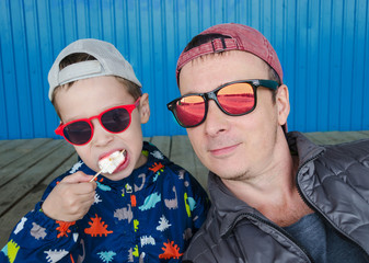 selfie portrait of father and son in sunglasses
