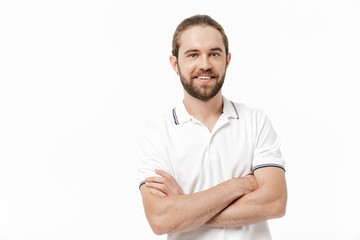 Bearded man posing isolated over white wall background.