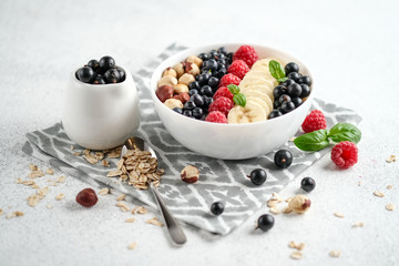 .Oatmeal with berries and fruits on a light background. Healthy breakfast.