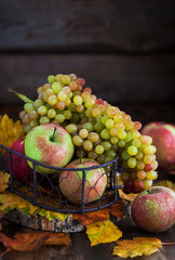 Fresh autumn apples and grapes