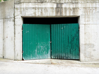 Temporary green gates in a garage under construction