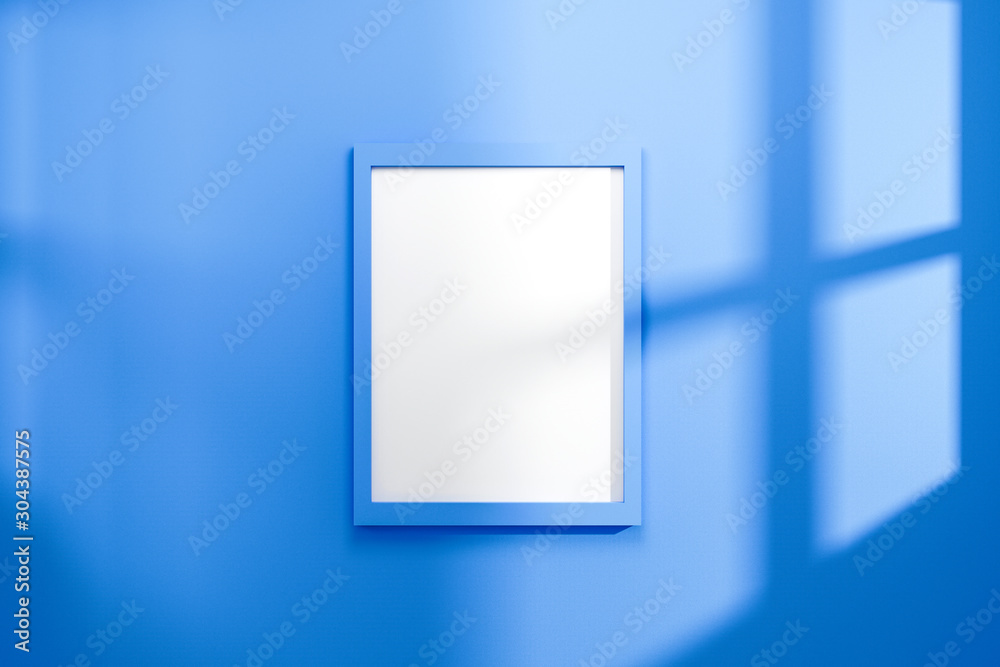Aufkleber empty frame on vivid blue wall background with natural light of window. display of showing exhibitio