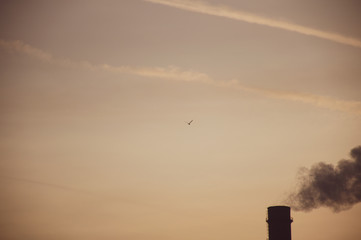 smoke from chimney on blue sky