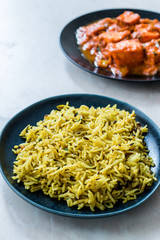 Indian Food Jeera Zira Rice Basmati Pilaf or Pilav with Paneer Butter Tikka Masala / Cheese Cottage Curry.
