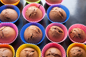 Cupcakes in multi-colored silicone molds.