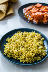 Indian Food Jeera Zira Rice Basmati Pilaf or Pilav with Paneer Butter Tikka Masala / Cheese Cottage Curry.