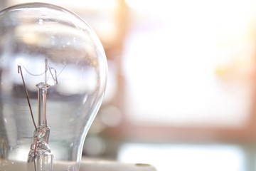 Tungsten bulbs placed on the table next to the door on a sunny day.