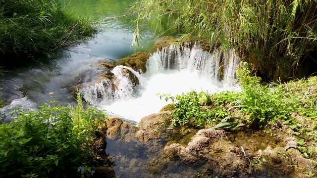 Little waterfall, frash cold water falling down