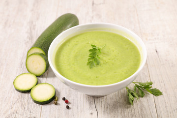 zucchini soup in bowl, winter comfortable soup