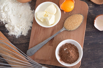 ingredients for sweet baking close-up on a wooden background