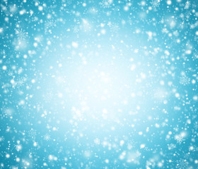 Abstract light blue winter background with snowflakes.