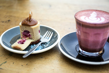 White chocolate blueberry raw cake with almond and velvet latte