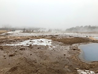 The Blesi Northern Pool, part of Haukadalur, the home of geysers and other geothermal features along the Golden Circle tourist route in southern Iceland on a foggy autumn afternoon