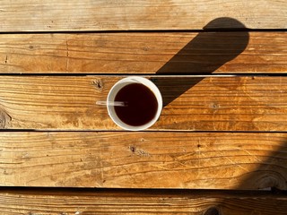 A cup of tea on a wooden background