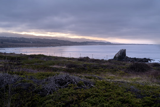 coastal dawn over sea rock