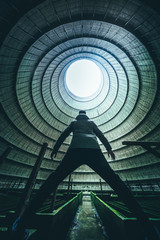 Obraz na płótnie Canvas Man standing inside a cooling tower