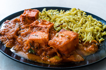 Indian Food Paneer Butter Tikka Masala / Cheese Cottage Curry and Jeera Zira Rice Basmati Pilaf or Pilav.