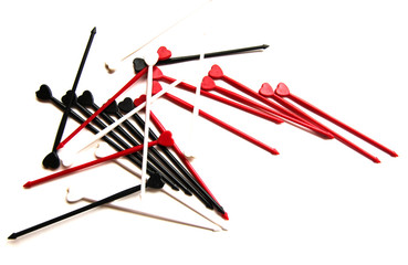 Black, white and red sticks whith heart for canapes on a white isolated background. Copy space.