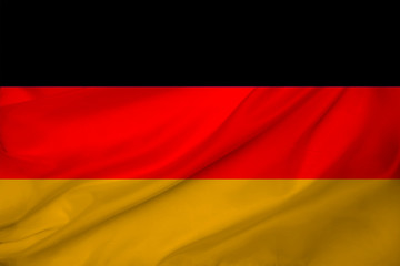 beautiful photo of the colored national flag of the modern state of Germany on textured fabric, concept of tourism, emigration, economics and politics, closeup
