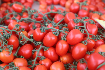closeup of tomatoes displayed on the market