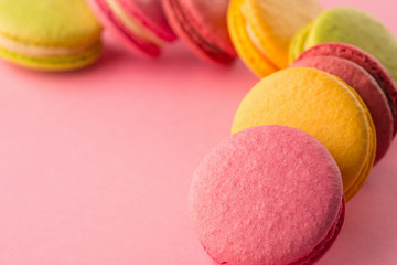 Sweet macarons on pink background