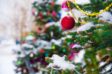 Christmas tree with decoration under snow