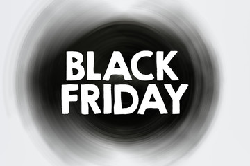 Black friday white text on black background. Business concept - the biggest sales of the year in showrooms.