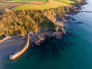 Aerial view of harbour wall and rocks Cornwall