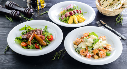 duck meat with cranberry cream in white plate on a black background