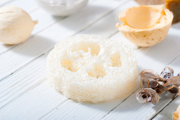 organic skin care butters from, shea, macadamia nut, coffee, mango, and cosmetic clay, mud on white wooden