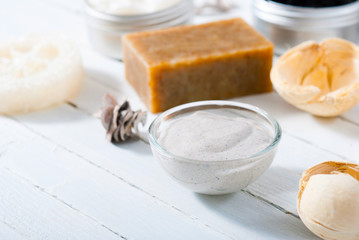 organic skin care butters from, shea, macadamia nut, coffee, mango, and cosmetic clay, mud on white wooden