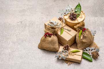 Christmas zero waste concept. New Year eco friendly packaging. Festive boxes in craft paper and...