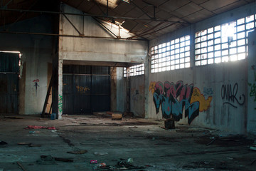 Abandoned dirty industry building with graffiti