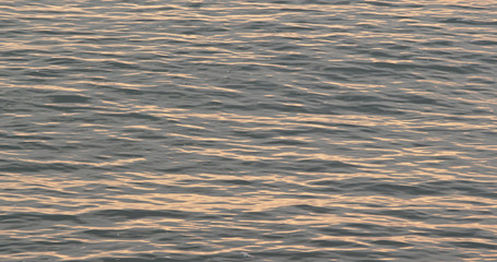 Sunset sunlight ray on the sea surface