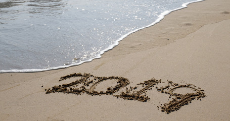 Number 2019 on sandy beach for new year concept