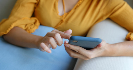 Woman use of mobile phone at home