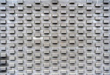 original design solutions in modern urban architecture. wall of a building made of paving slabs.