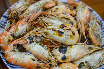 Large burnt shrimp placed on a plate