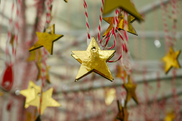 Golden paper hanging on a rope in the alley stars