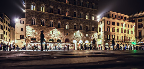 People in Piazza della Signoria in Florence at night