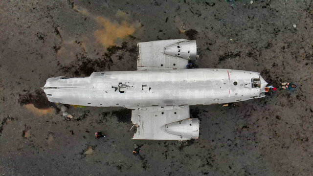 Airplane Wreckage in Solheimasandur Black Beach, aerial view of Iceland - Powered by Adobe