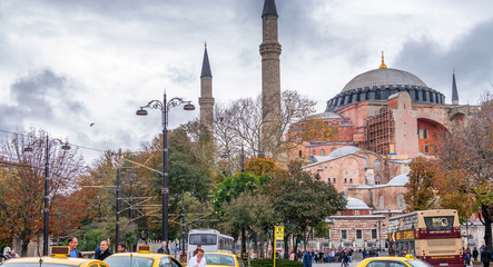 ISTANBUL - OCTOBER 25, 2014: Yellow taxis in front of Hagia Sofia