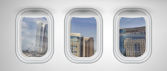 Beautiful scenic city view of Abu Dhabi through the aircraft windows