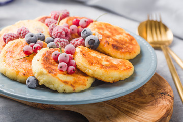 Breakfast with cheesecake,  fresh berries .  Cottage cheese pancakes or curd fritters. Russian syrniki or sirniki