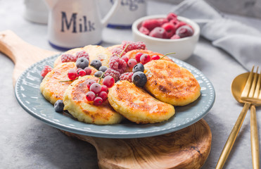 Breakfast with cheesecake,  fresh berries .  Cottage cheese pancakes or curd fritters. Russian syrniki or sirniki