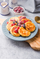 Breakfast with cheesecake,  fresh berries .  Cottage cheese pancakes or curd fritters. Russian syrniki or sirniki