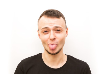 emotion stuck out tonge, young man in a black cap on a white background, man emoji