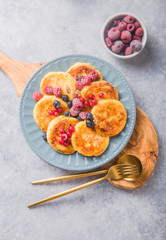 Breakfast with cheesecake,  fresh berries .  Cottage cheese pancakes or curd fritters. Russian syrniki or sirniki